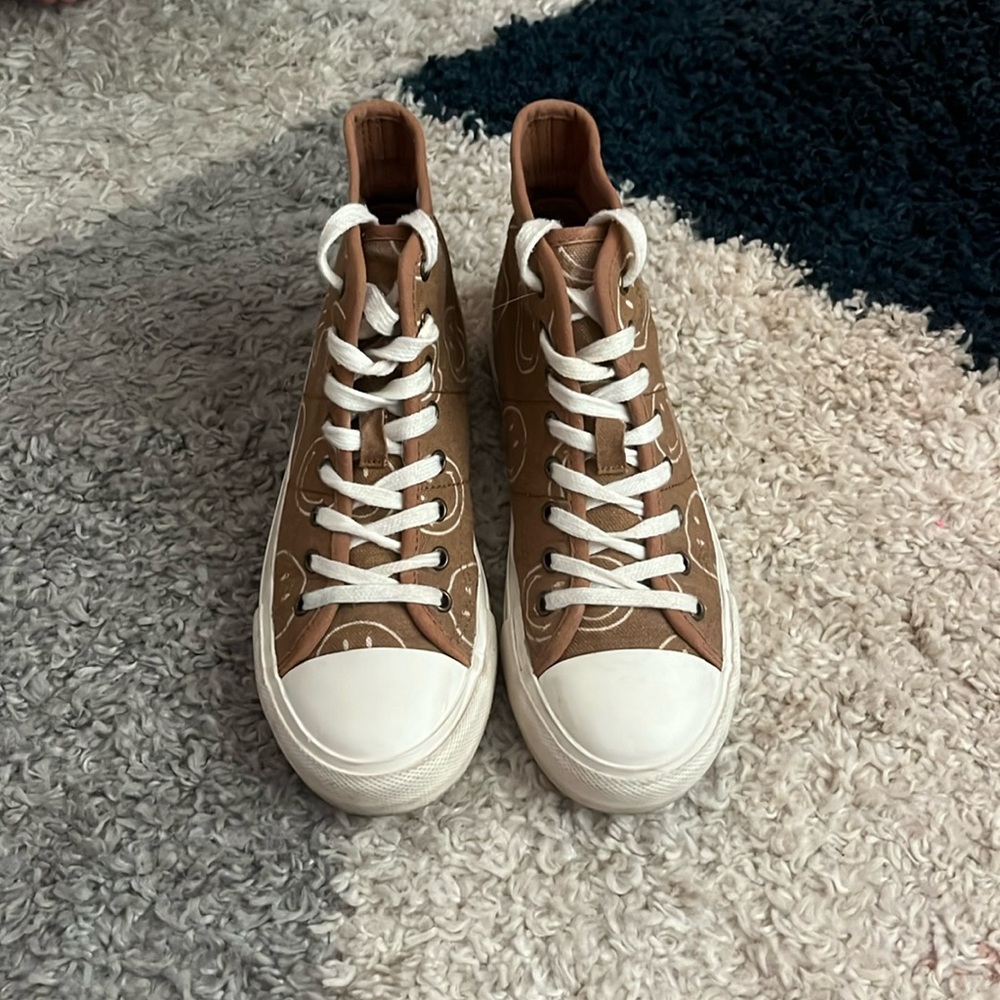 Brown with white smiley faces, American eagle shoes.